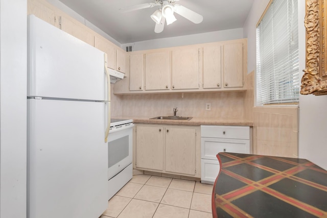 kitchen featuring sink, tasteful backsplash, white appliances, light tile patterned floors, and ceiling fan