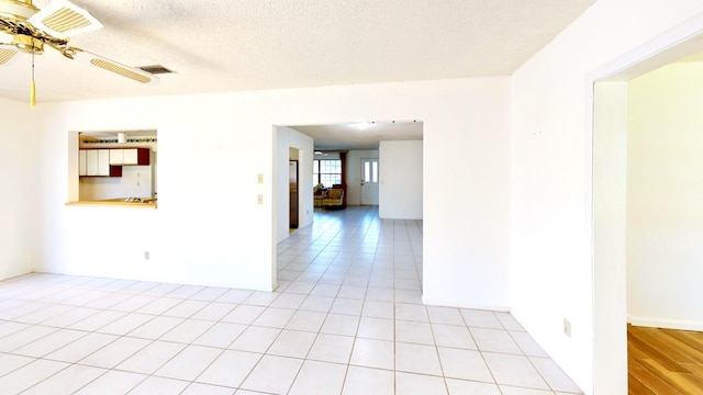 479 SE Verada Ave, Port Saint Lucie, FL 34983 - spare room with visible vents, a textured ceiling, and light tile patterned flooring