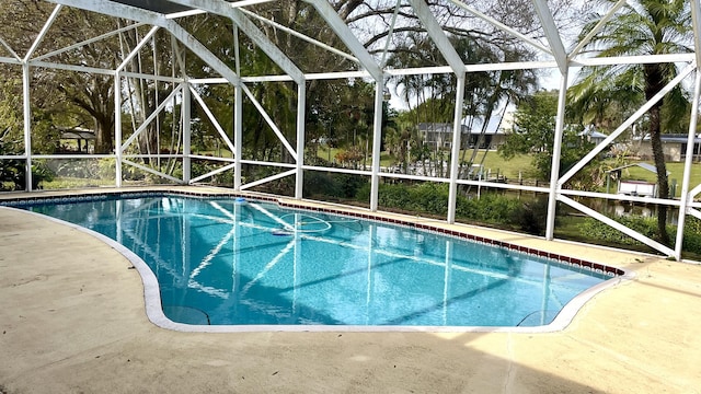 view of pool with a lanai