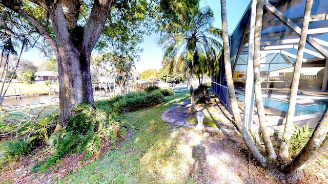 479 SE Verada Ave, Port Saint Lucie, FL 34983 - view of yard with glass enclosure and an outdoor pool