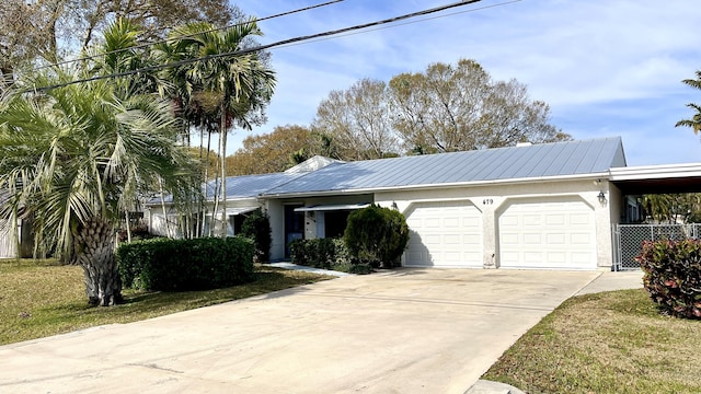 ranch-style house with a garage and a front yard