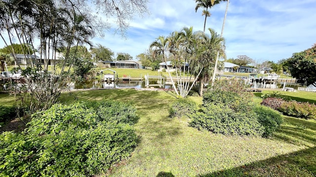 479 SE Verada Ave, Port Saint Lucie, FL 34983 - view of yard with a water view, boat lift, and a boat dock