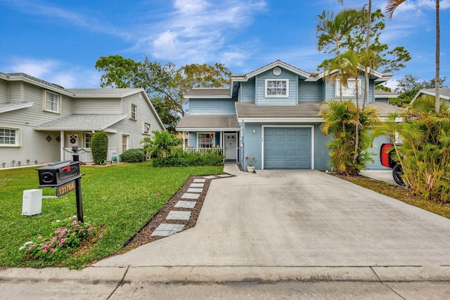 front of property featuring a front lawn and a garage