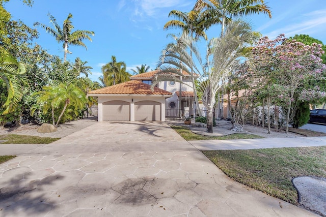 mediterranean / spanish house featuring a garage