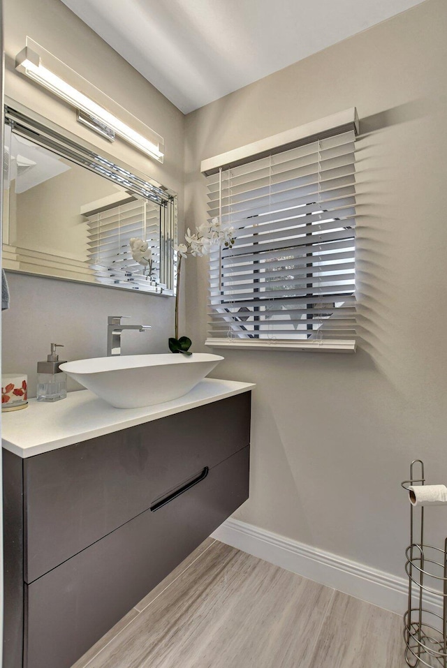 bathroom featuring vanity and hardwood / wood-style floors