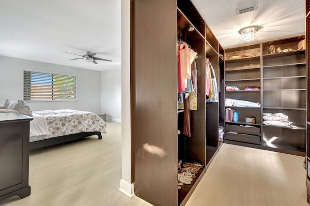 bedroom featuring light hardwood / wood-style flooring and ceiling fan