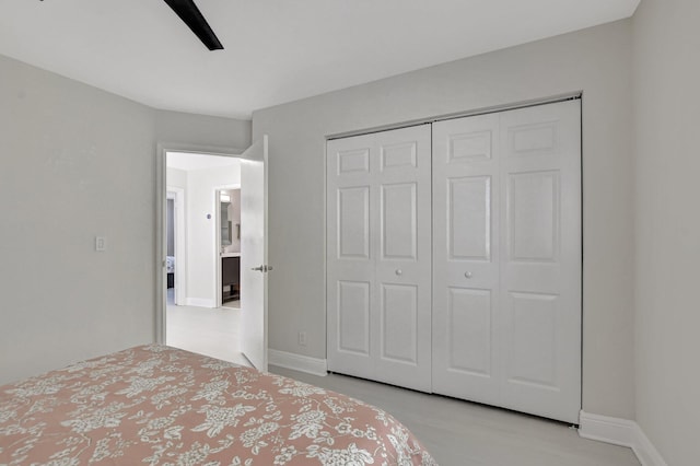 bedroom with ceiling fan and a closet