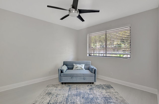 sitting room featuring ceiling fan