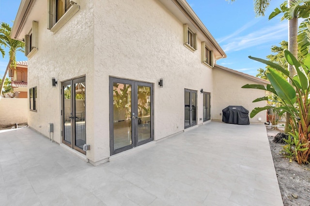 back of house featuring french doors and a patio area