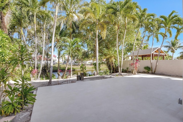 view of patio with a water view