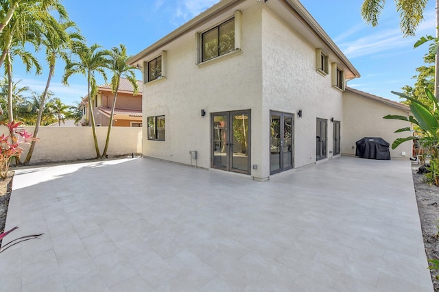 rear view of house featuring a patio area