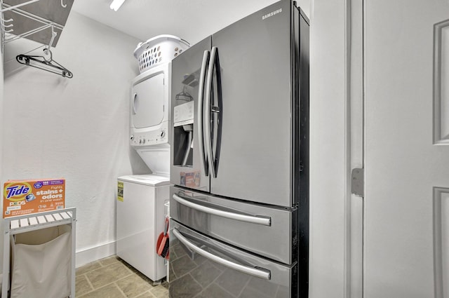 laundry room with stacked washer and clothes dryer