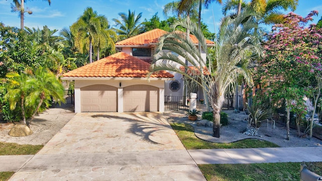 mediterranean / spanish-style home featuring a garage