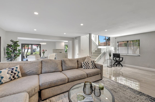 living room featuring plenty of natural light and light wood-type flooring