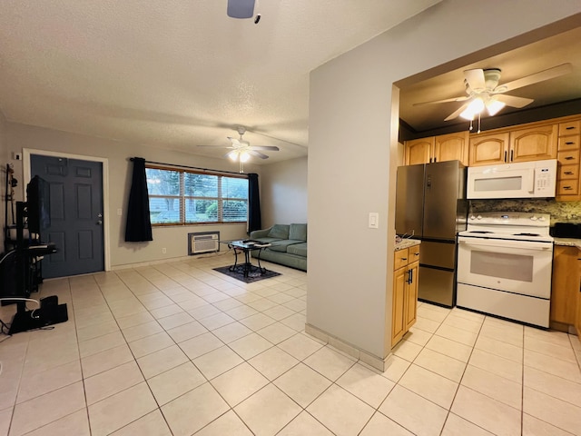 kitchen featuring light tile patterned floors, ceiling fan, tasteful backsplash, white appliances, and a textured ceiling