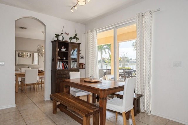 dining area featuring light tile patterned floors