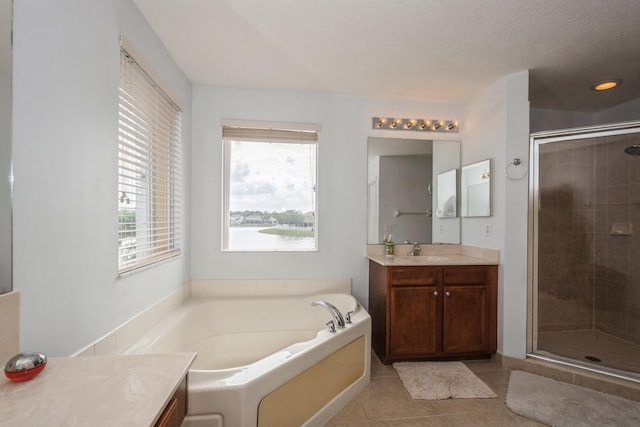 bathroom featuring vanity, separate shower and tub, and tile patterned flooring