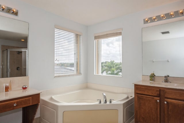 bathroom featuring plus walk in shower and vanity