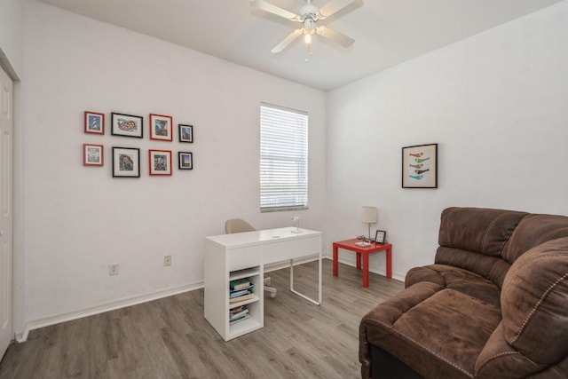 office space featuring ceiling fan and light hardwood / wood-style floors