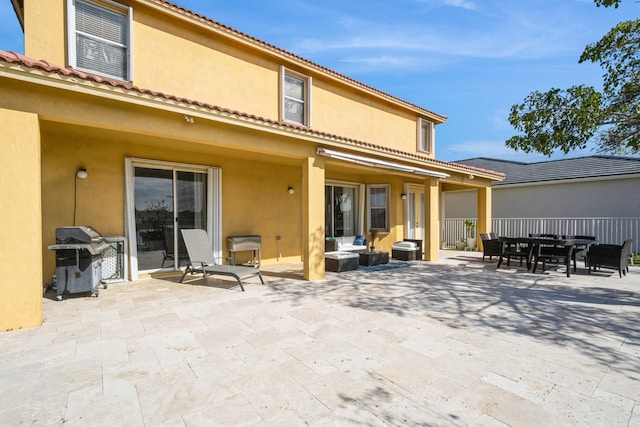 back of house with a patio area