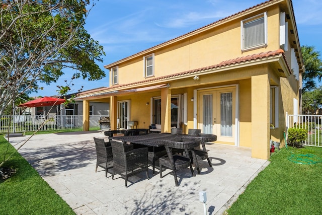 back of house with a patio