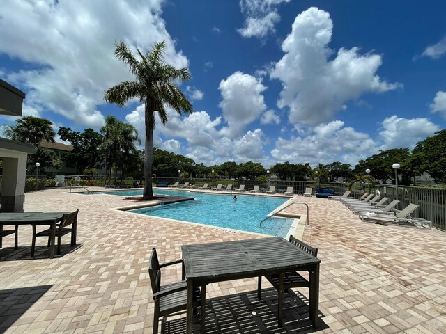 1401 Village Blvd Unit 136, West Palm Beach, FL 33409 - view of pool featuring a patio