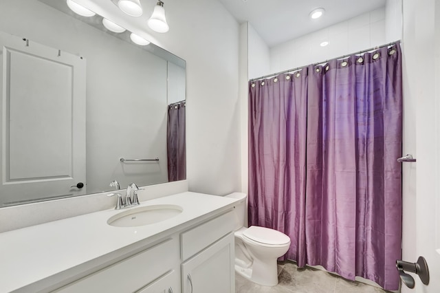 bathroom featuring vanity, walk in shower, and toilet