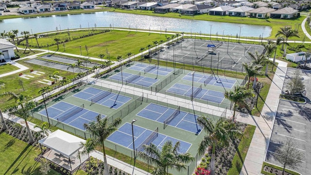 birds eye view of property featuring a residential view and a water view