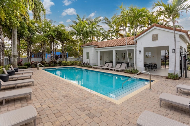 view of swimming pool with a patio