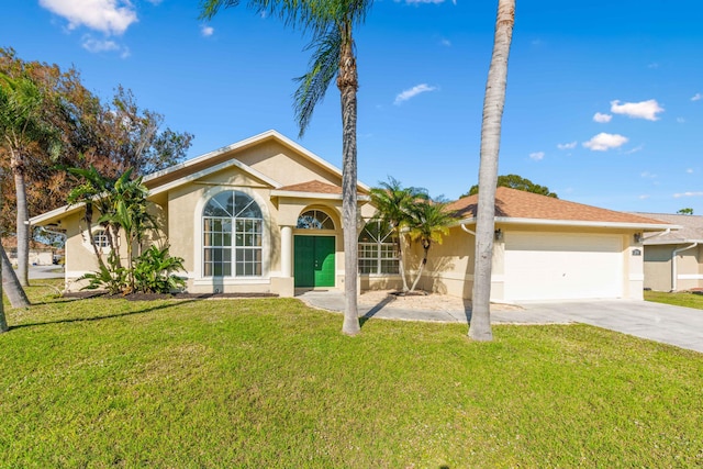 view of front of home with a garage and a front yard