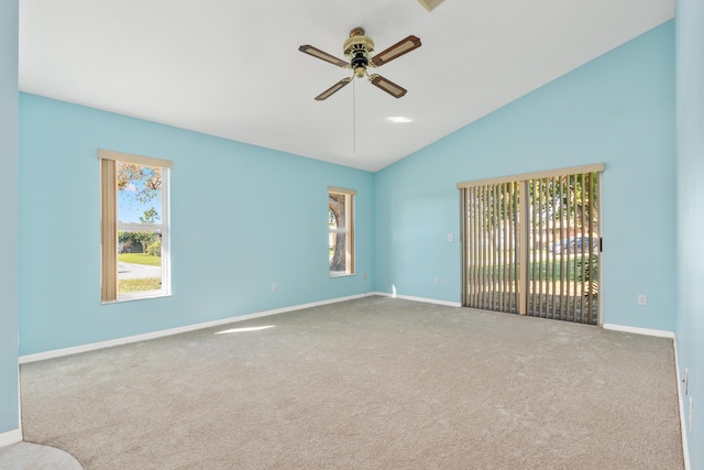 unfurnished room featuring ceiling fan, vaulted ceiling, and carpet floors