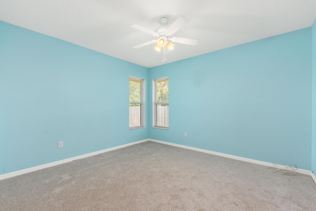 carpeted empty room with ceiling fan