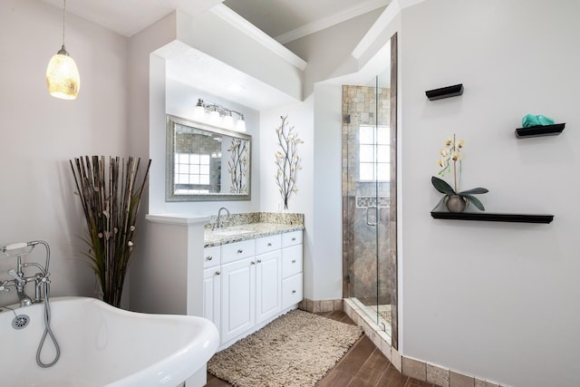 bathroom with crown molding, vanity, and an enclosed shower