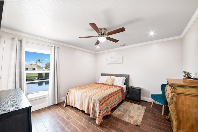 bedroom with crown molding, dark hardwood / wood-style floors, and ceiling fan