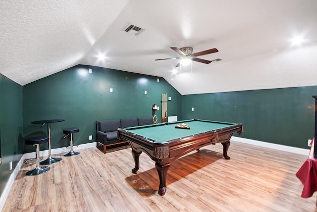 playroom featuring lofted ceiling, pool table, light hardwood / wood-style floors, and a textured ceiling