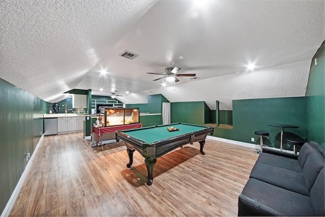 recreation room featuring lofted ceiling, billiards, ceiling fan, light hardwood / wood-style floors, and a textured ceiling