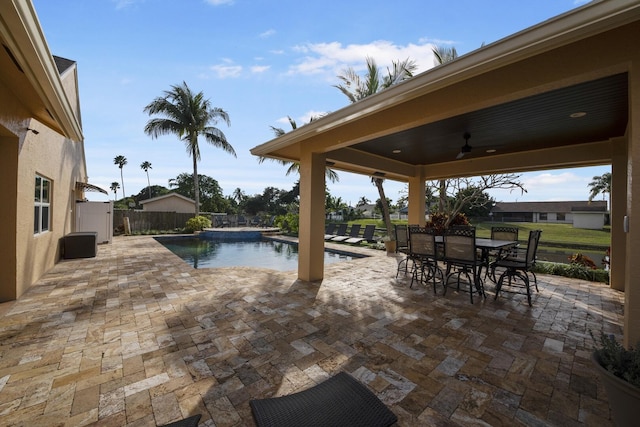 view of pool with a patio area and ceiling fan