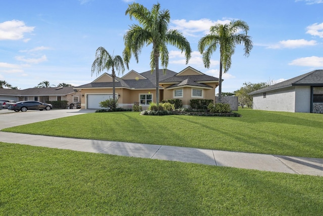 single story home featuring a garage and a front yard