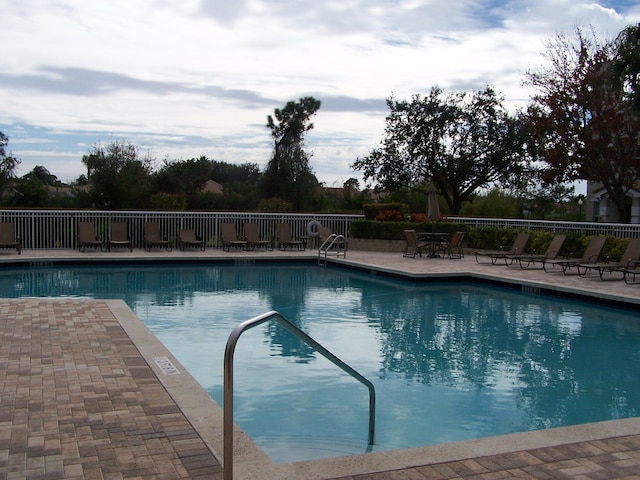 view of swimming pool featuring a patio