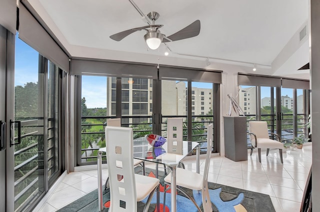 sunroom with ceiling fan, french doors, and a healthy amount of sunlight