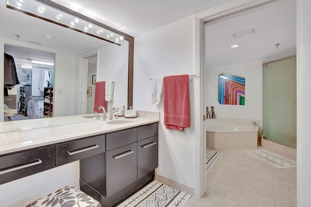 bathroom with vanity and a bathtub