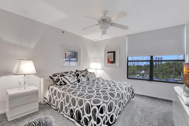 bedroom featuring ceiling fan and carpet