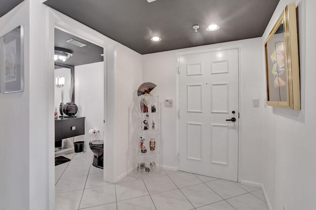 entrance foyer featuring light tile patterned flooring