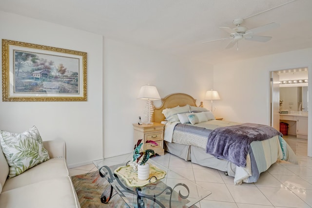 tiled bedroom featuring ceiling fan and connected bathroom