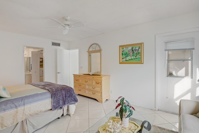 bedroom with ceiling fan, connected bathroom, and light tile patterned floors