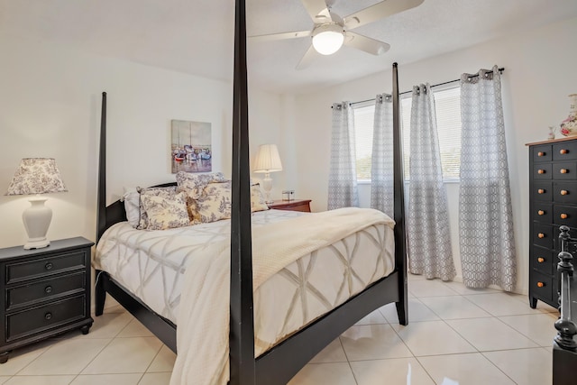 tiled bedroom with ceiling fan