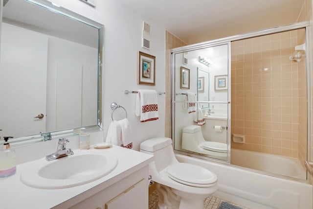 full bathroom featuring bath / shower combo with glass door, toilet, and vanity