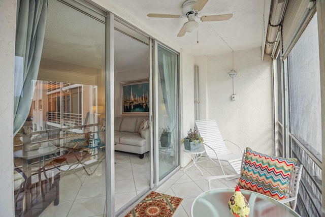 sunroom / solarium with ceiling fan