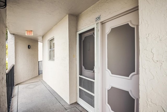 entrance to property with a balcony