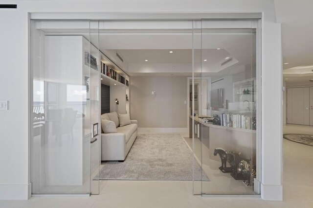 living room featuring a raised ceiling